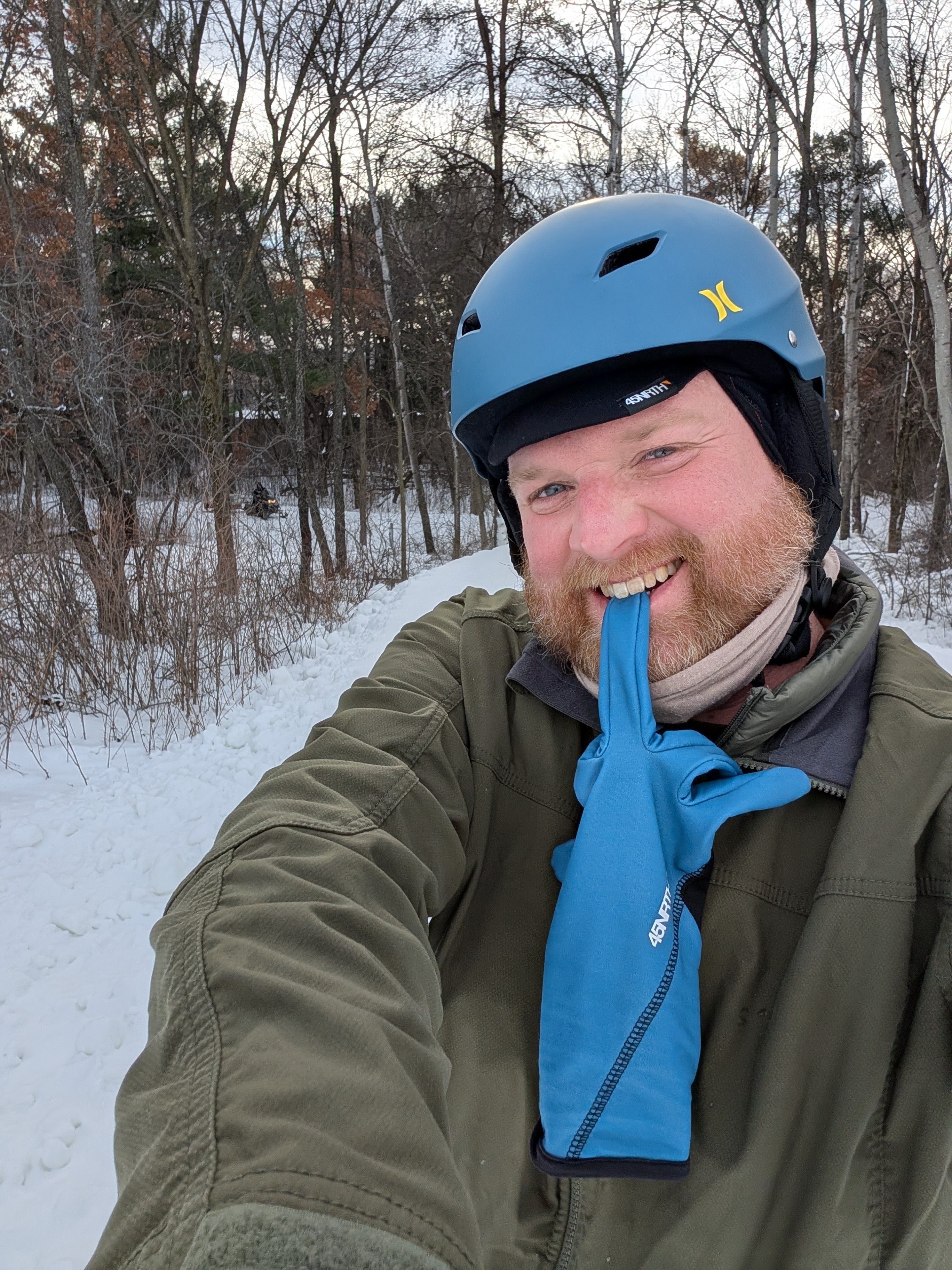 Winter bike ride, snow trail, big smile